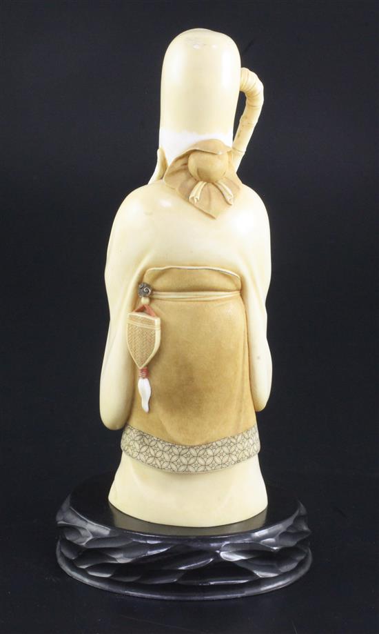 A Japanese ivory figure of Fukurokuju, early 20th century, 20cm, wood stand